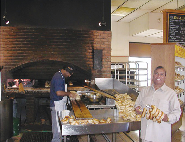 Pyare Sharma at the Kettleman’s Bagel franchise on Carling Avenue. Photo submitted by Ranjeev Sharma