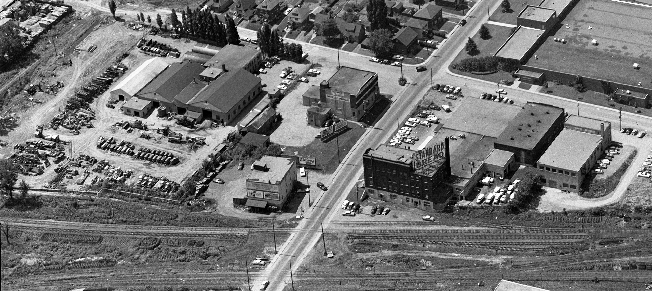 An aerial oblique photo from 1961 which is years after the Oliver factory was gone, but shows the area at least, and the last still-standing Oliver building right by the train tracks. Not useful for the print edition, but maybe a bonus photo for the online edition? National Aerial Photo Library image