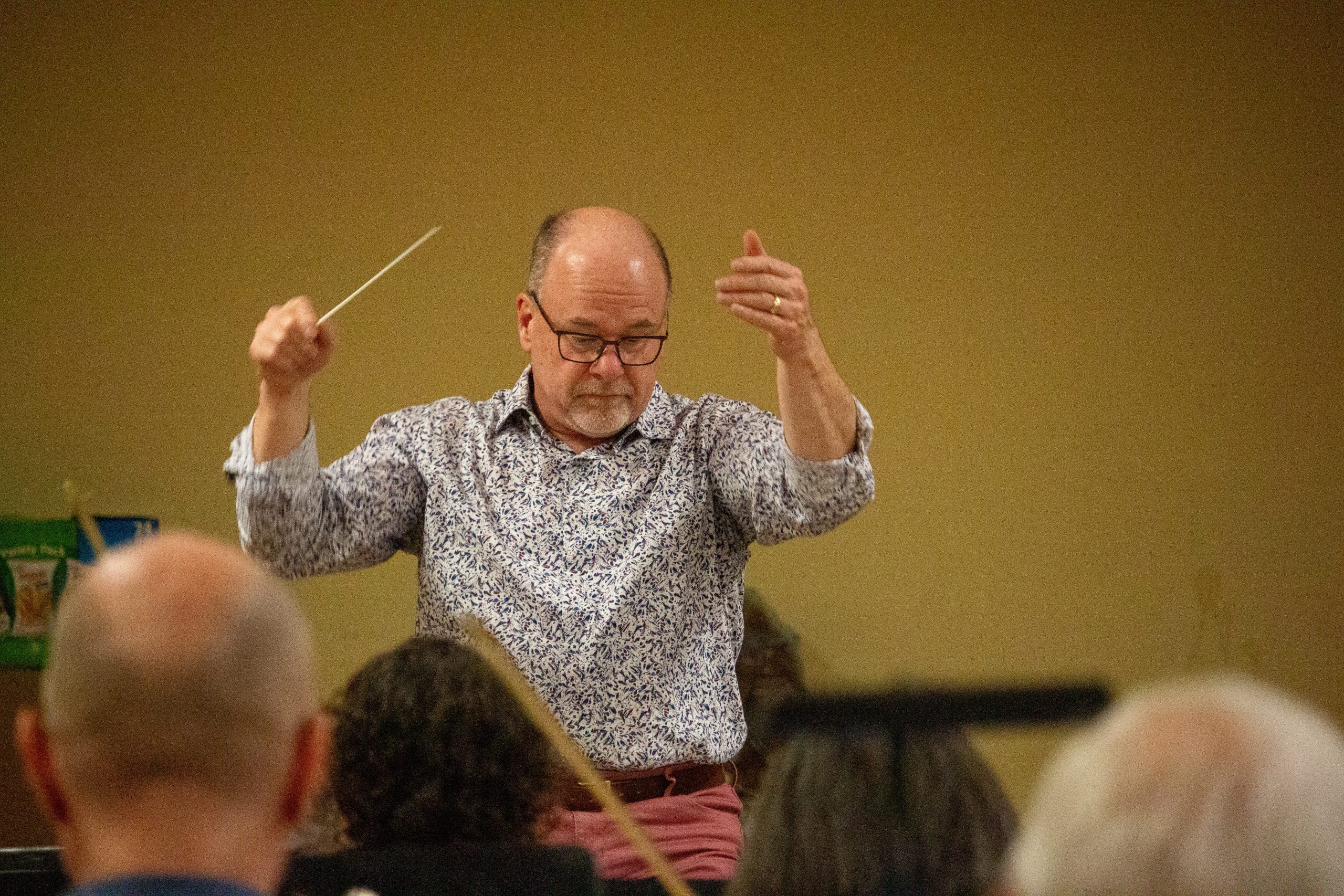 John Kraus is pictured conducting the orchestra. 