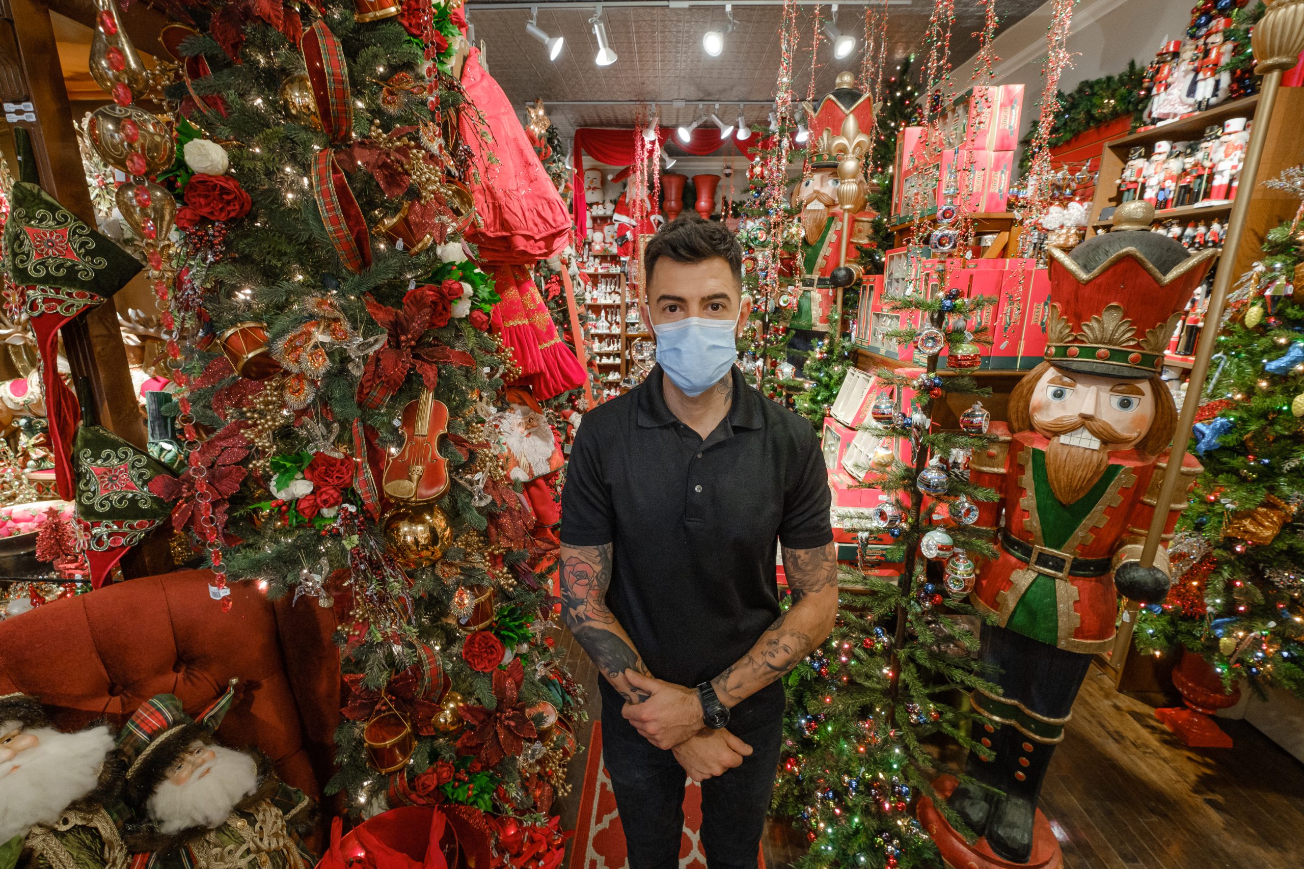 Audy Czigler stands in the middle of a decorated Tinseltown store in Hintonburg.