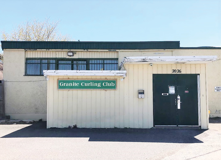 The exterior of the Granite Curling Club on a sunny spring day in Ottawa