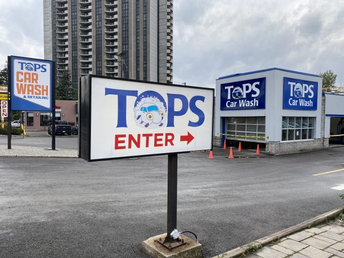 The outside sign at Tops Car Wash on Richmond Road|