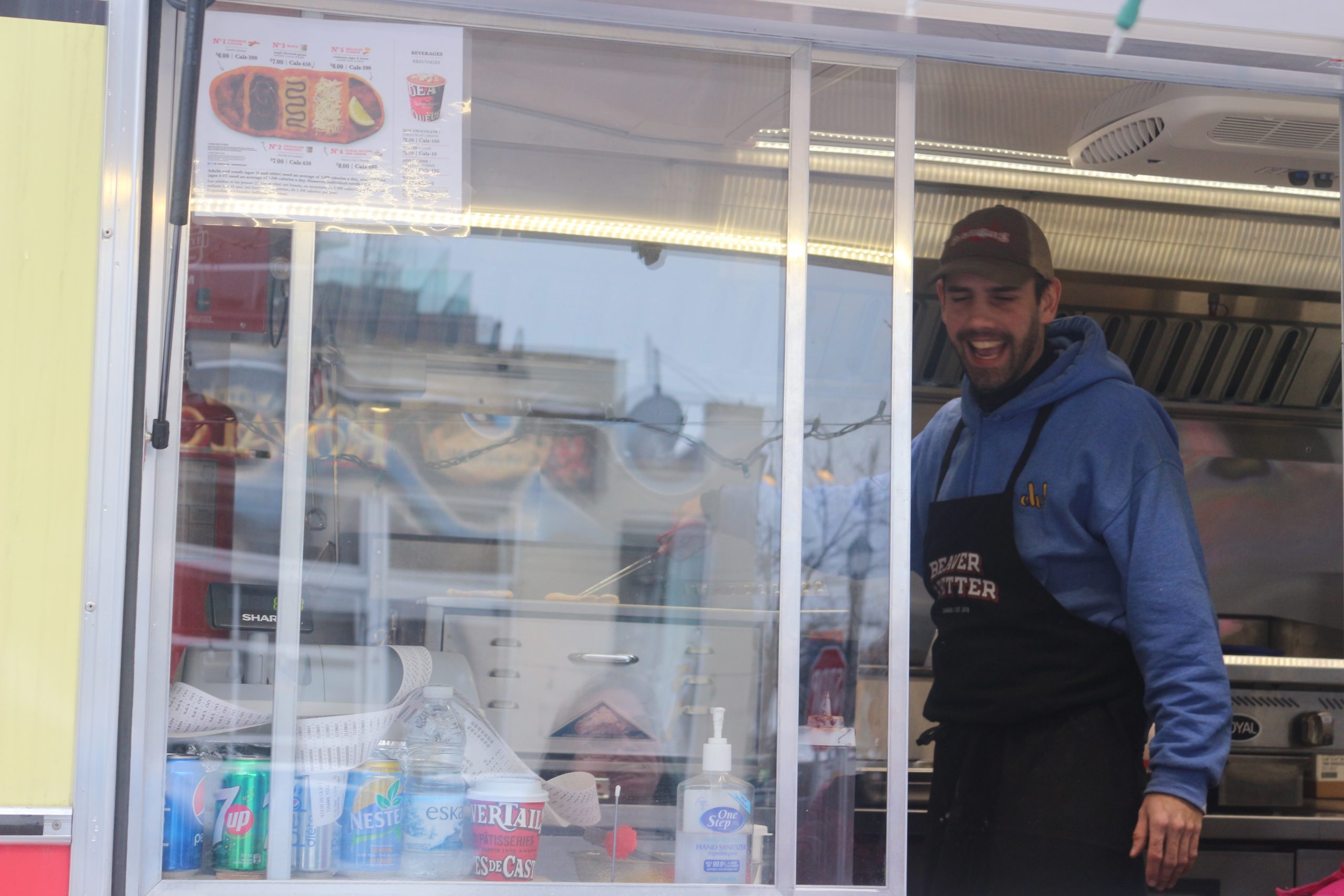 Jonas Piva serves up BeaverTails in the “Beau Benji” in the parking lot of West Park Lanes Bowling Alley. 