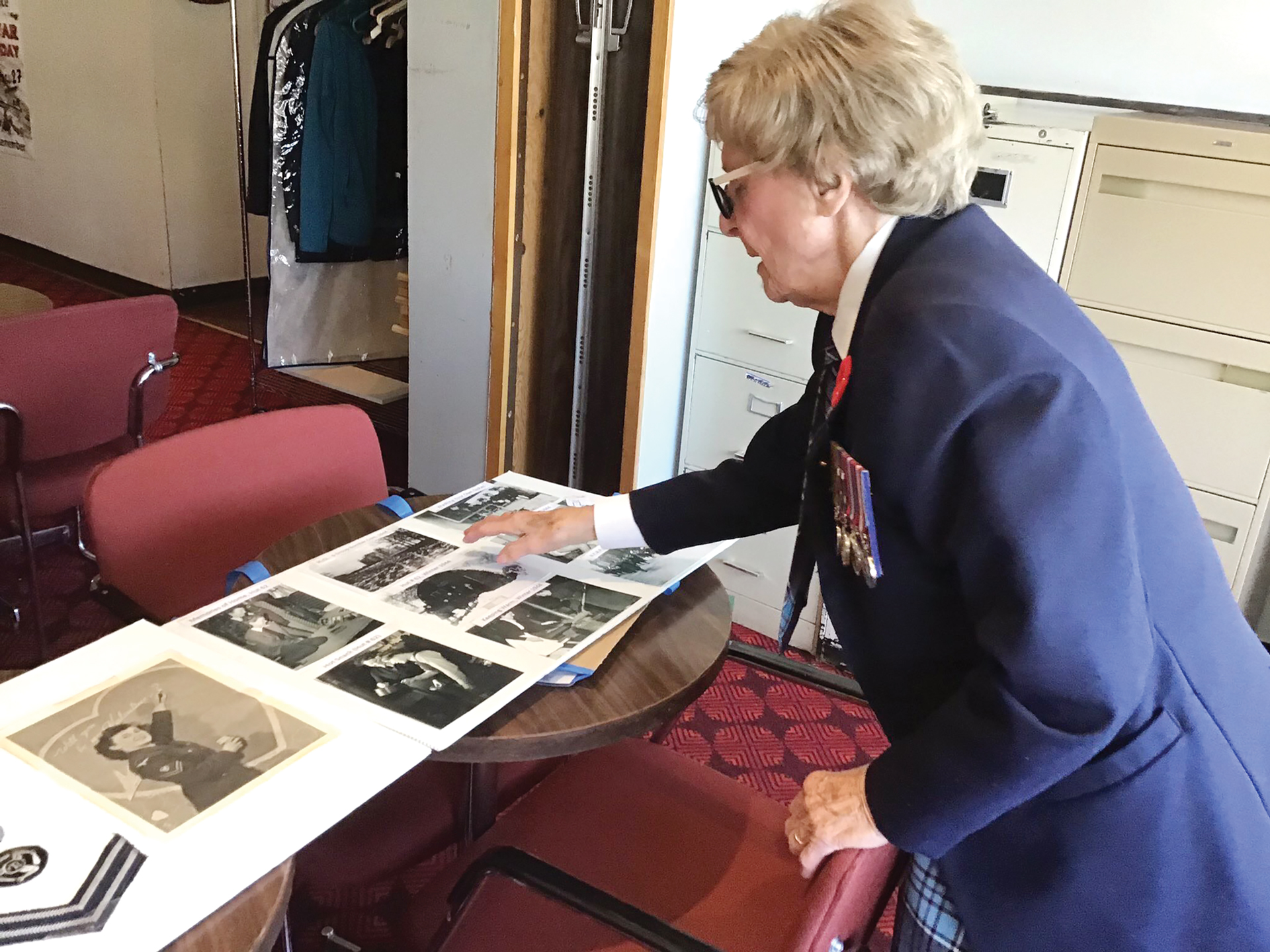 Connie Mooney looks at some of her old photos from her time serving during World War II to commemorate Remembrance Day.