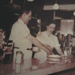 A photo of Jimmy and Jane working behind the counter at Jimmy's Restaurant.