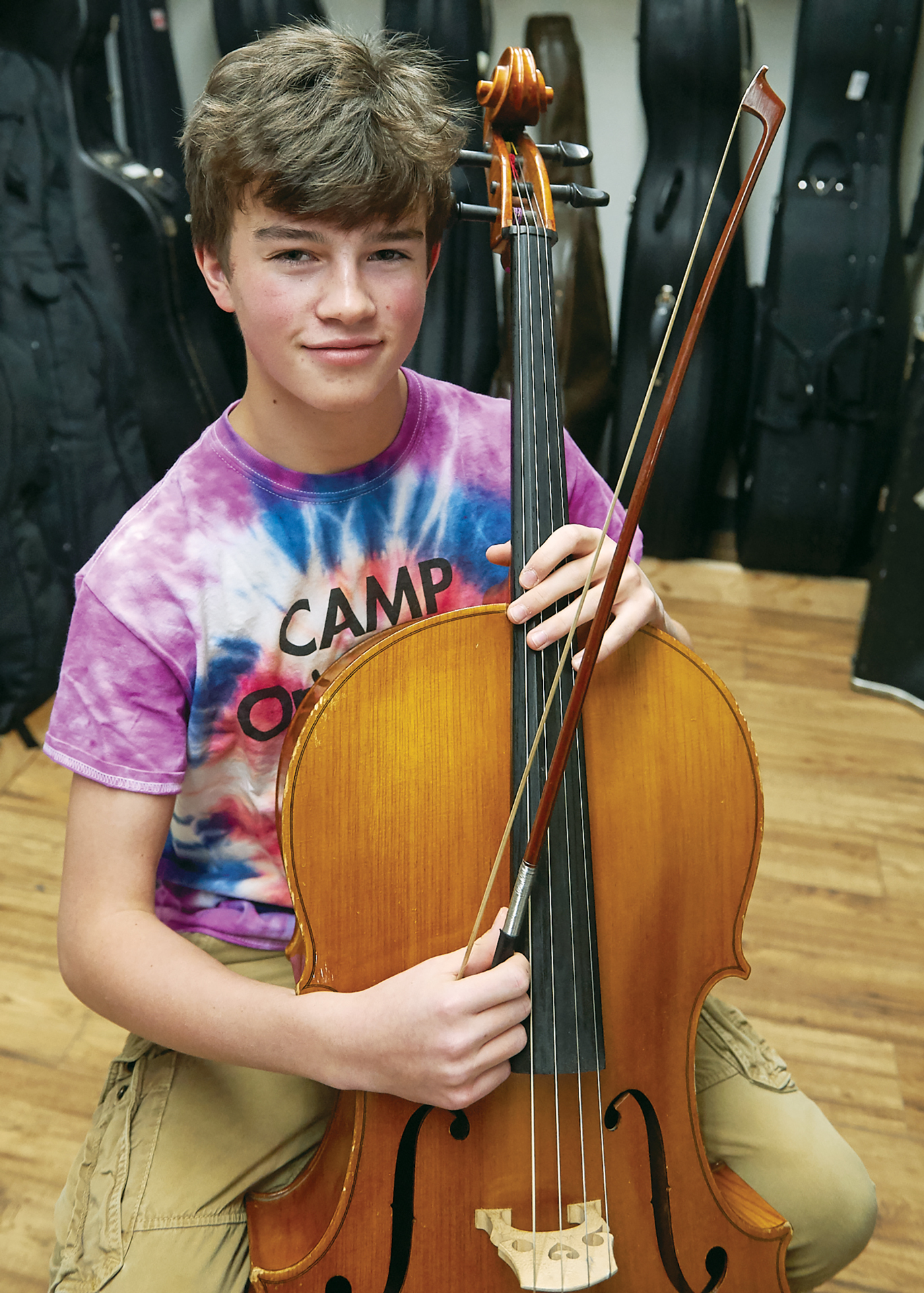 Noah Linson-Hudson, a 14-year-old Kitchissippi resident holds his cello.