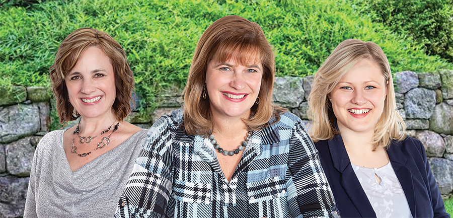 Professional headshots of three Susan Chell agents are seen against a green, leafy background