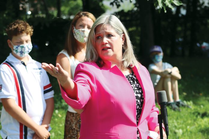 NDP Leader Andrea Horwath speaks at an outdoor event in Kitchissippi.|A photo of school trustee Justine Bell wears a mask in Ottawa.