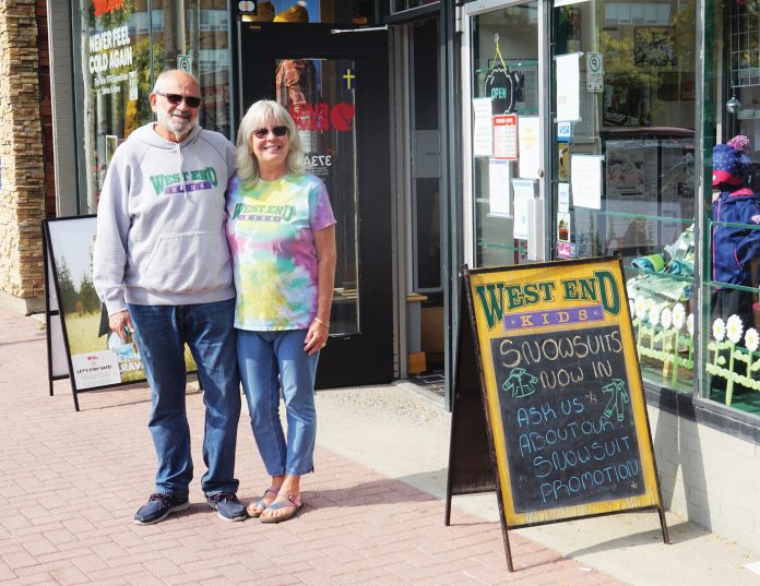 A photo of West End Kids owners Gordie and Sheba Schmidt standing outside their Westboro store.|A 1995 photo of the exterior of West End Kids in Westboro just before the store opened.