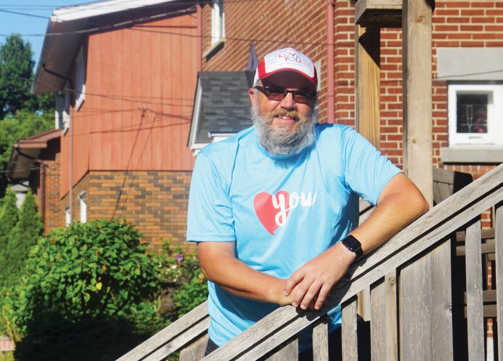 A photo of Marc Gagnon arriving at home in Hintonburg after his 24 hour walk for mental health.