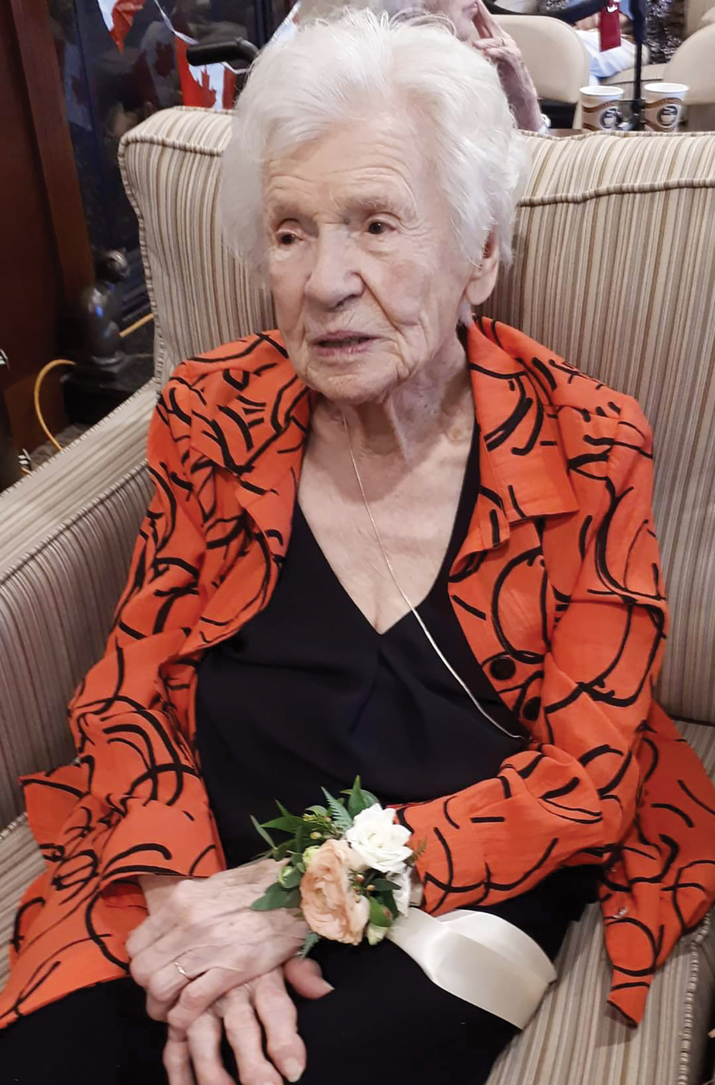 A photo of Ida Crocker sitting in a chair at her 99th birthday.