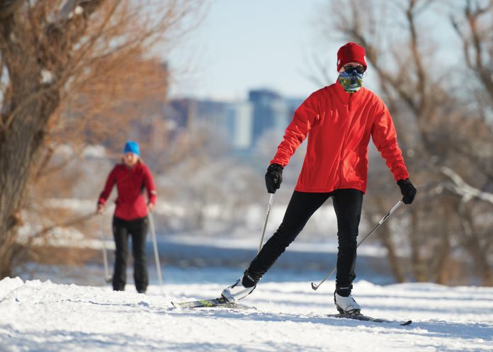 A skier wearing a red jacket