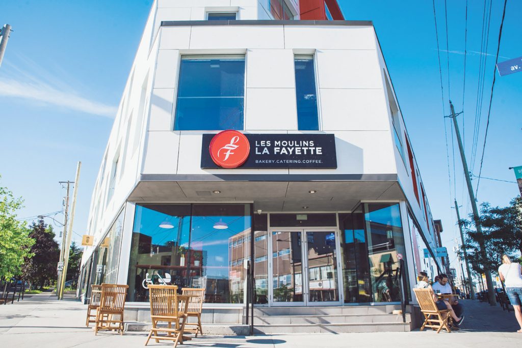 The entrance of Les Moulins La Fayette in Hintonburg on a sunny day.