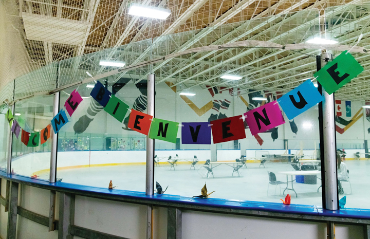 A brightly coloured welcome banner hangs at the Tom Brown Arena Respite Centre