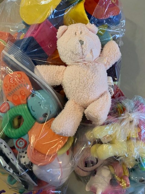 A pile of toys in bags for donation