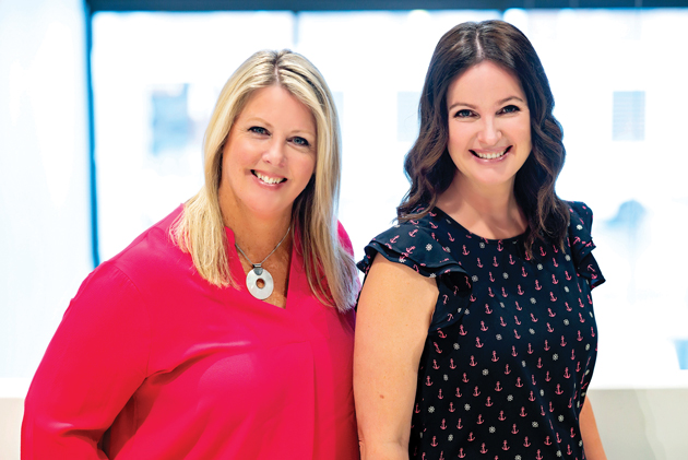 Kelly and Kerry are seen in a professional headshot against a window background