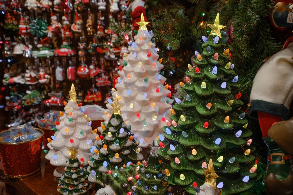 White and green lit tree decorations at Tinseltown