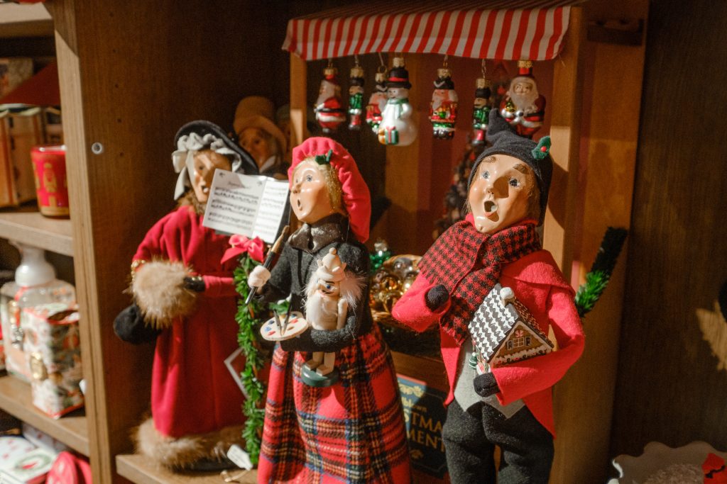 Three caroler decorations at Tinseltown