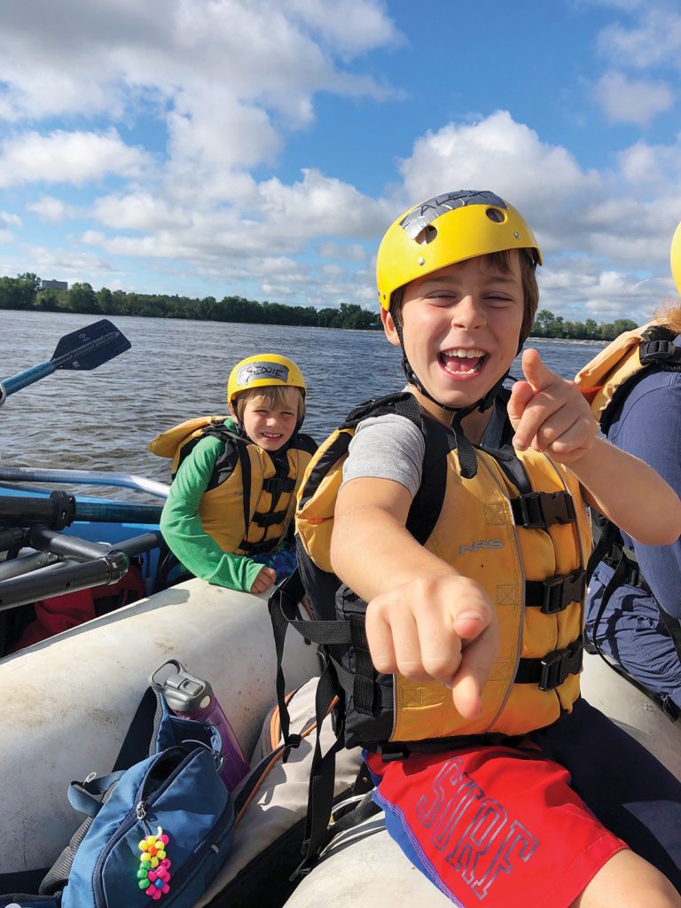 A photo of two children water rafting in Ottawa through Dovercourt's programming.