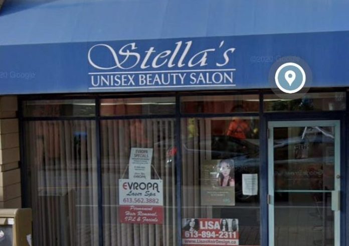 The outside of Stella's Unisex Beauty Salon on a sunny day in Hintonburg|Stella Mail does the hair of a young woman at a hair salon