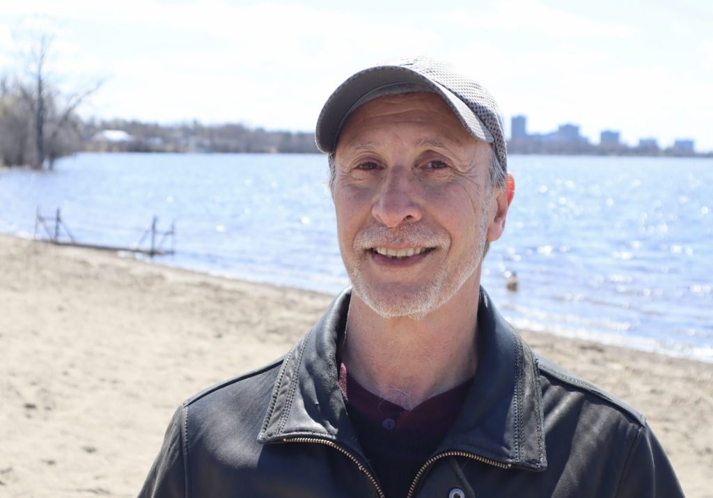 Len poses for a photo at Westboro Beach. 