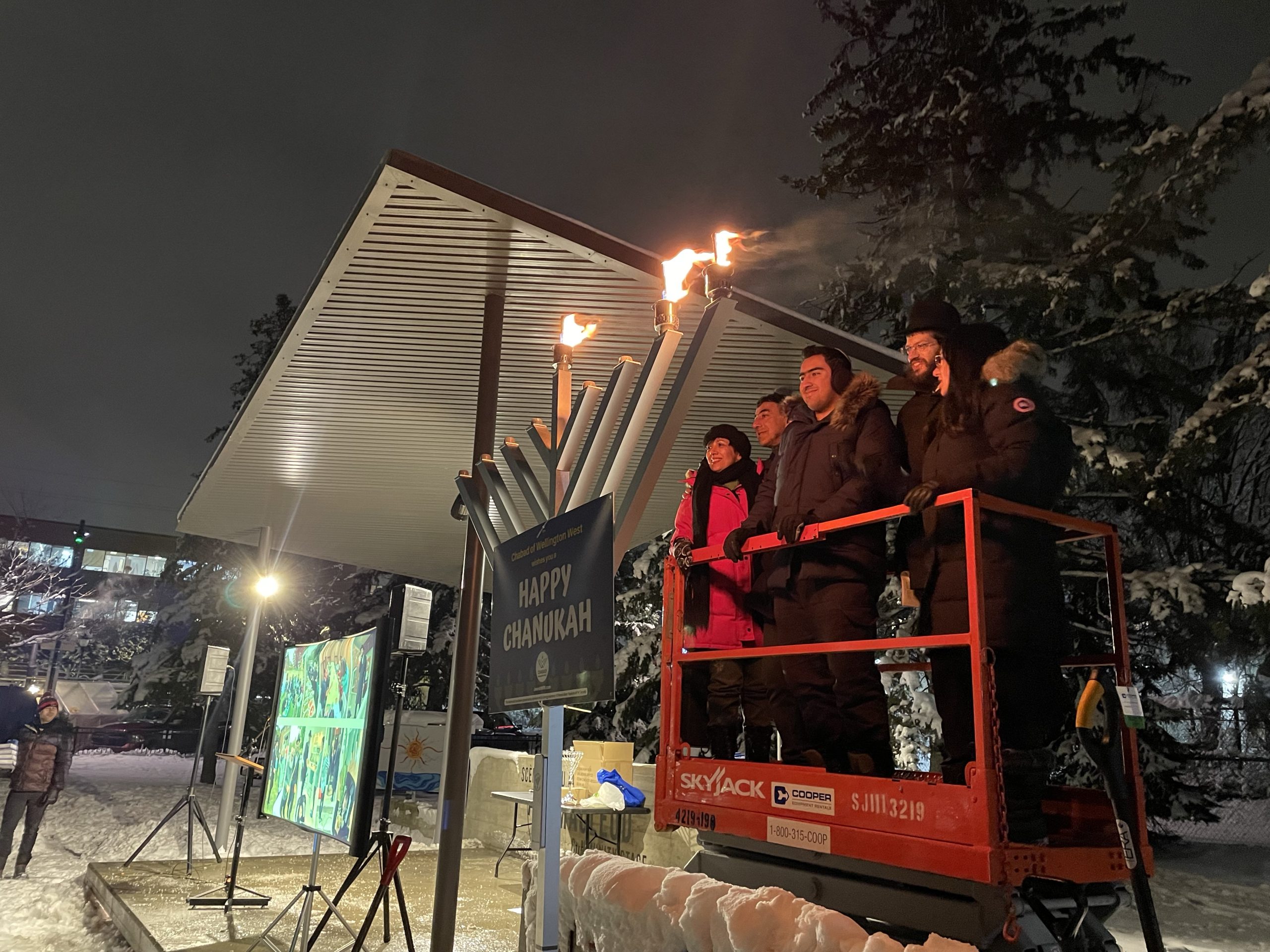 A menorah is lit in Parkdale Park