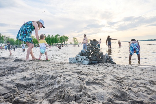 Kitchissippi residents enjoy the return of summer weather at Britannia Beach over the May long weekend. Photo by Aaron Reid. 