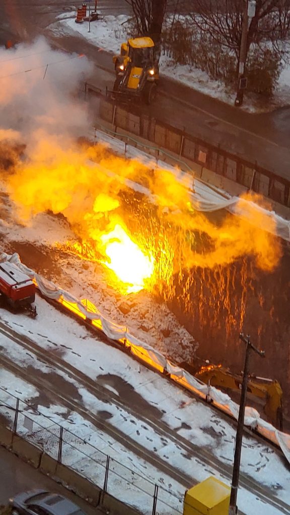 A orange ball of flames comes out of the LRT construction site on Byron. 