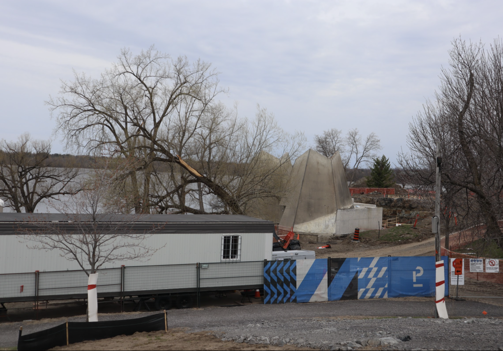 Westboro Beach seen from on top of the hill. Construction fencing and machinery is in the sanded area.