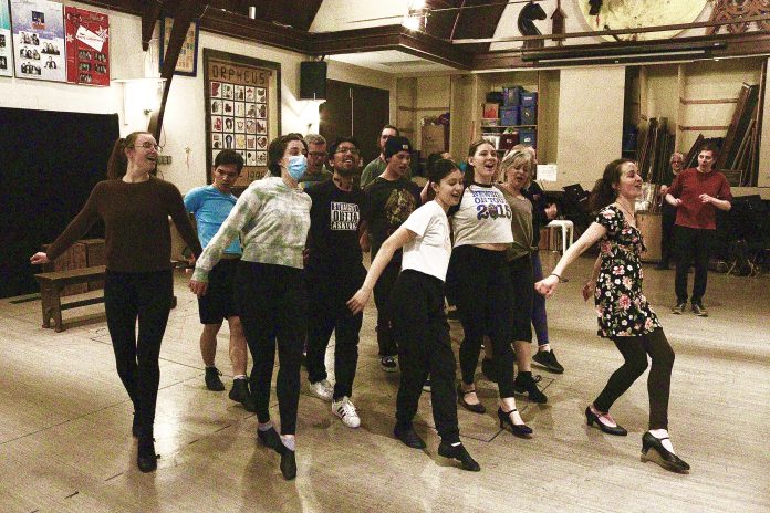 Members of the Something Rotten cast rehearse a dance move.