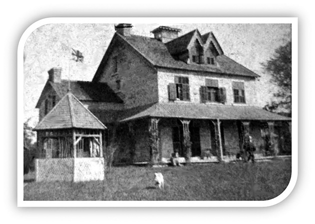 A black and white photo of the Manor House. 