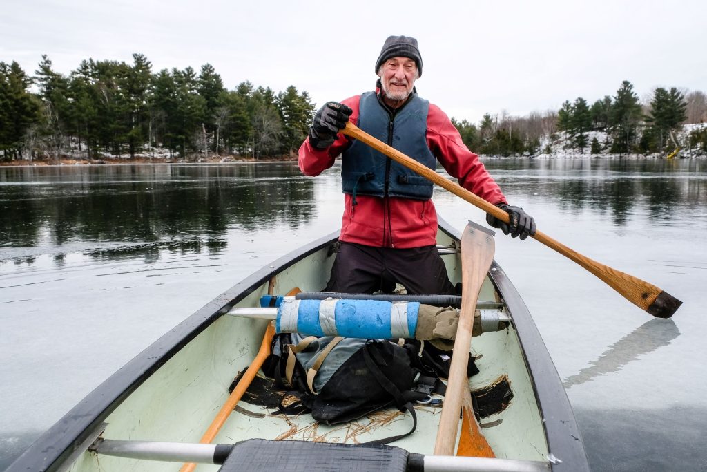 Max paddles a canoe. 