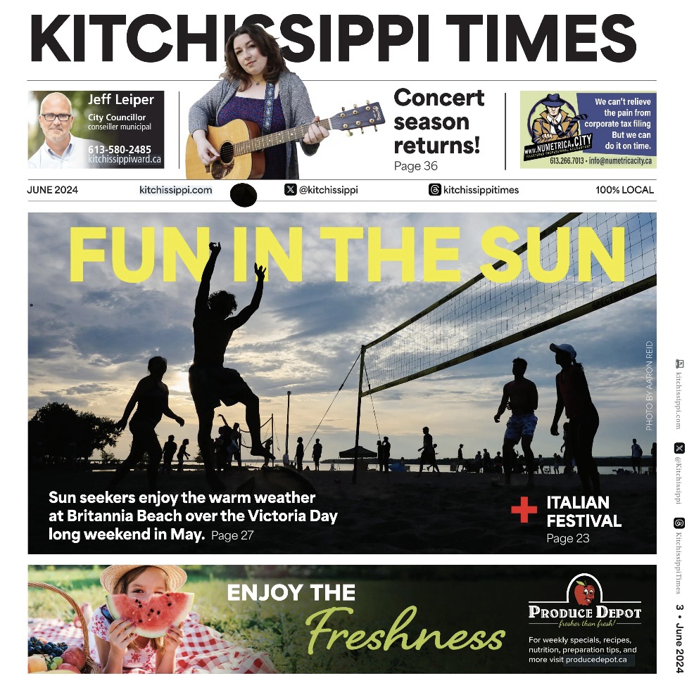 A newspaper cover showing people playing volleyball at Britannia Beach. 