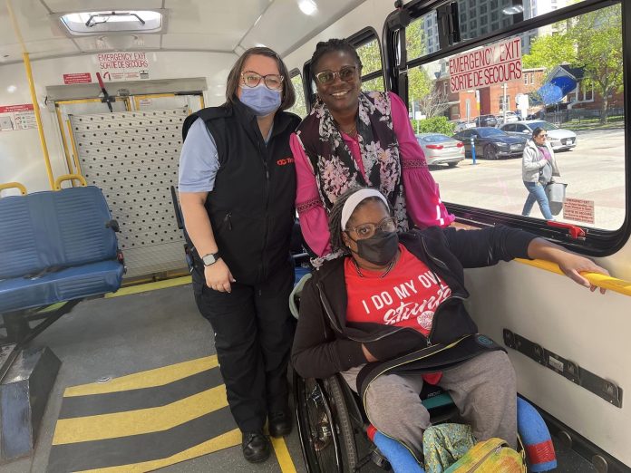 Centretown resident Sally Thomas (centre) with OC Transpo general manager Rene Amilcar (right). Provided photo.