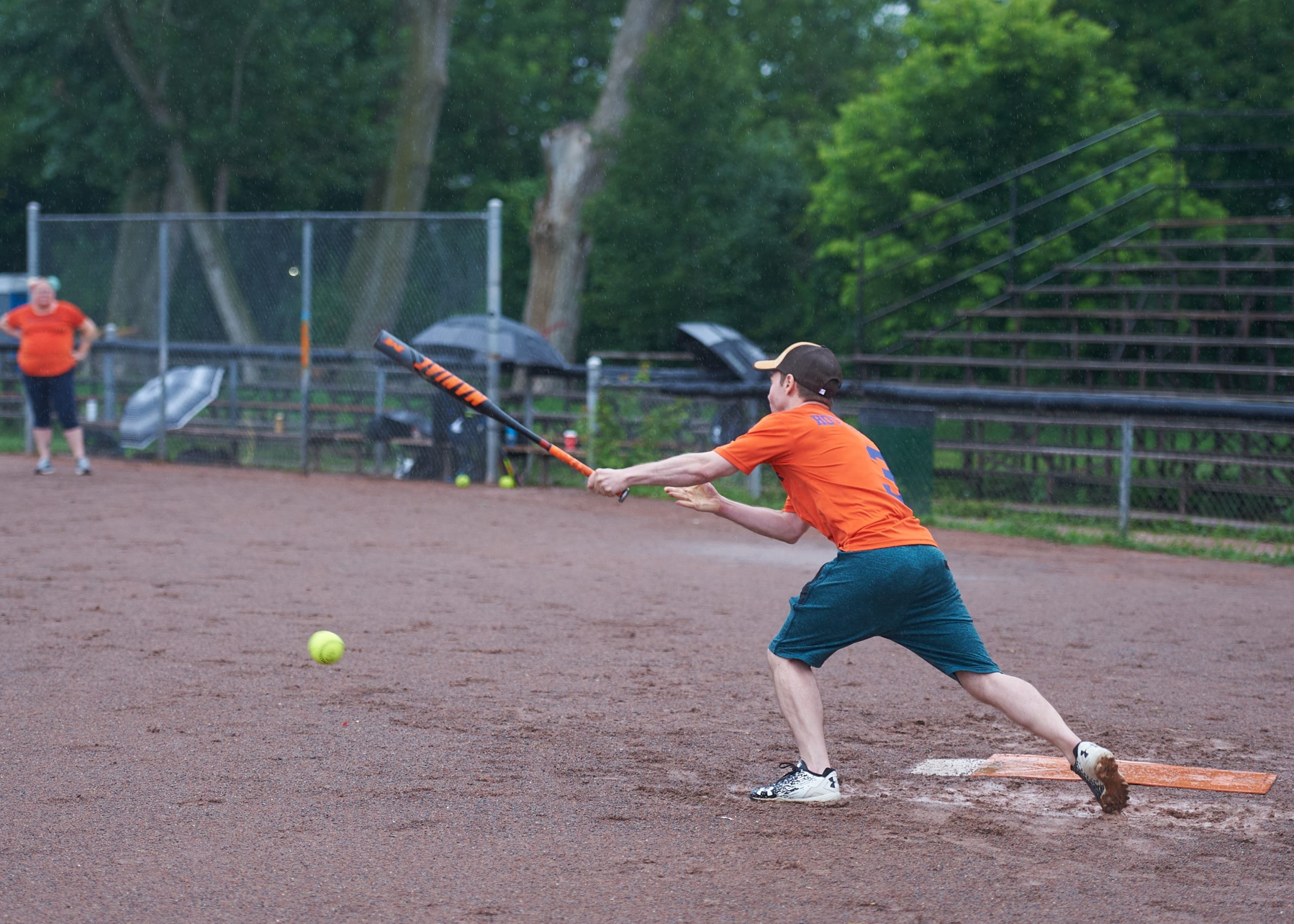 Bradley attempts to hit the ball with his bat. 