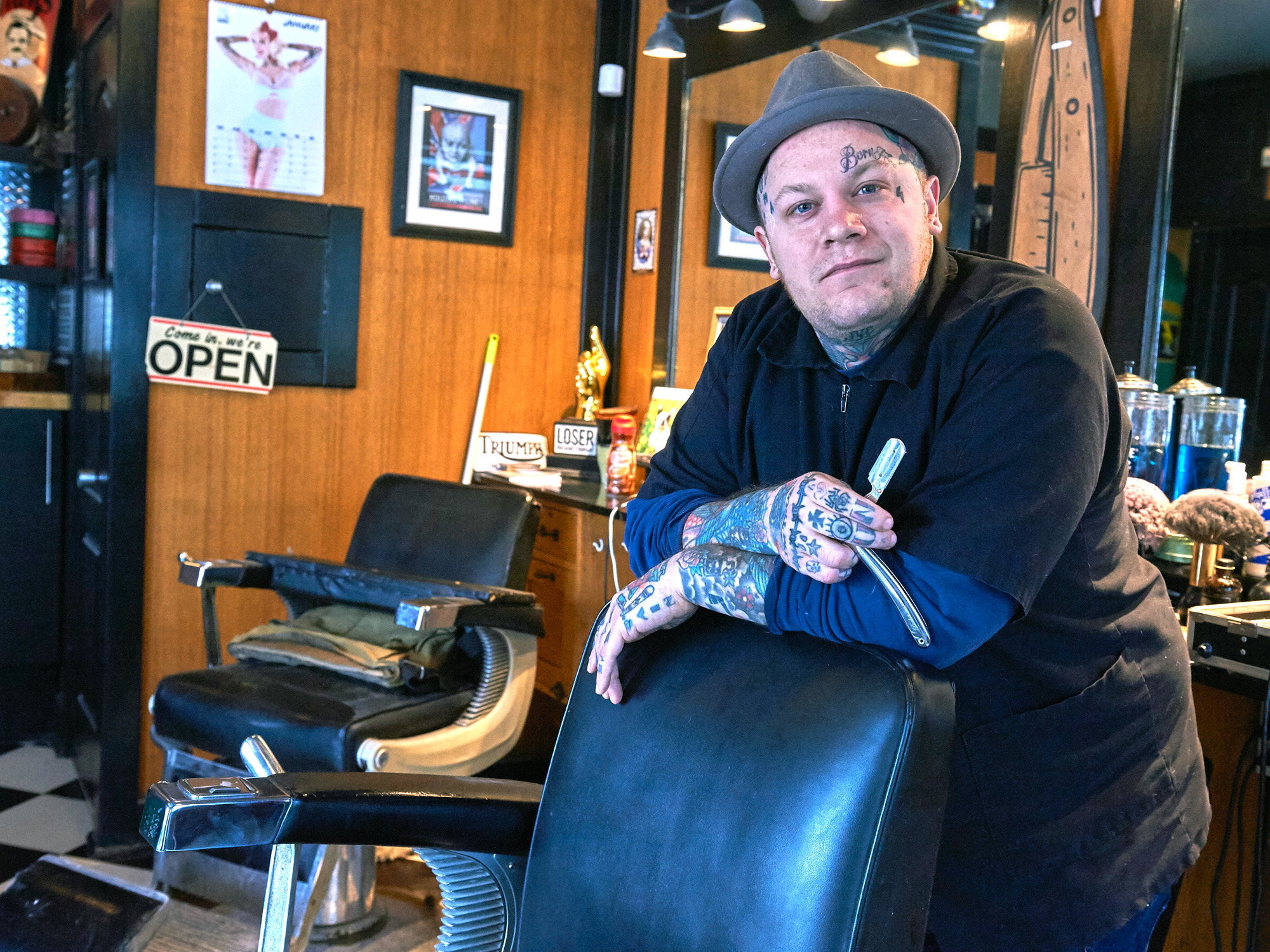 “This is where I hope to be cutting hair when I’m eighty-five,” says Devon Hayter, the man behind the chair at The Brooke. “I hope to pass this on to someone else who will keep this as a barber shop.” Photo by Ellen Bond