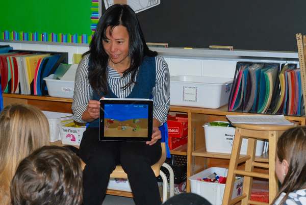  Evelyn Eldridge testing her math app with students at Churchill P.S. Photo by Andrea Douglas