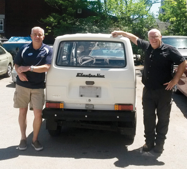 John Rapp and Frank Gifford with Dovercourt’s new/old electric vehicle. It will be on the road later this summer. Photo by Bradley Turcotte