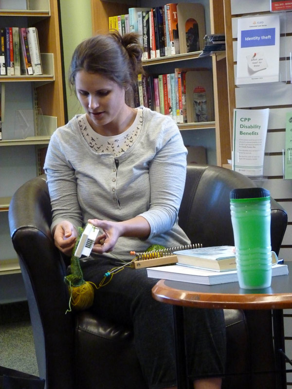 Carlingwood Library Knitting Club founder Kelly Wojnarski. “I’m hopeless with needles,” she explains as she demonstrates the two knitting machines she’s using to make socks.