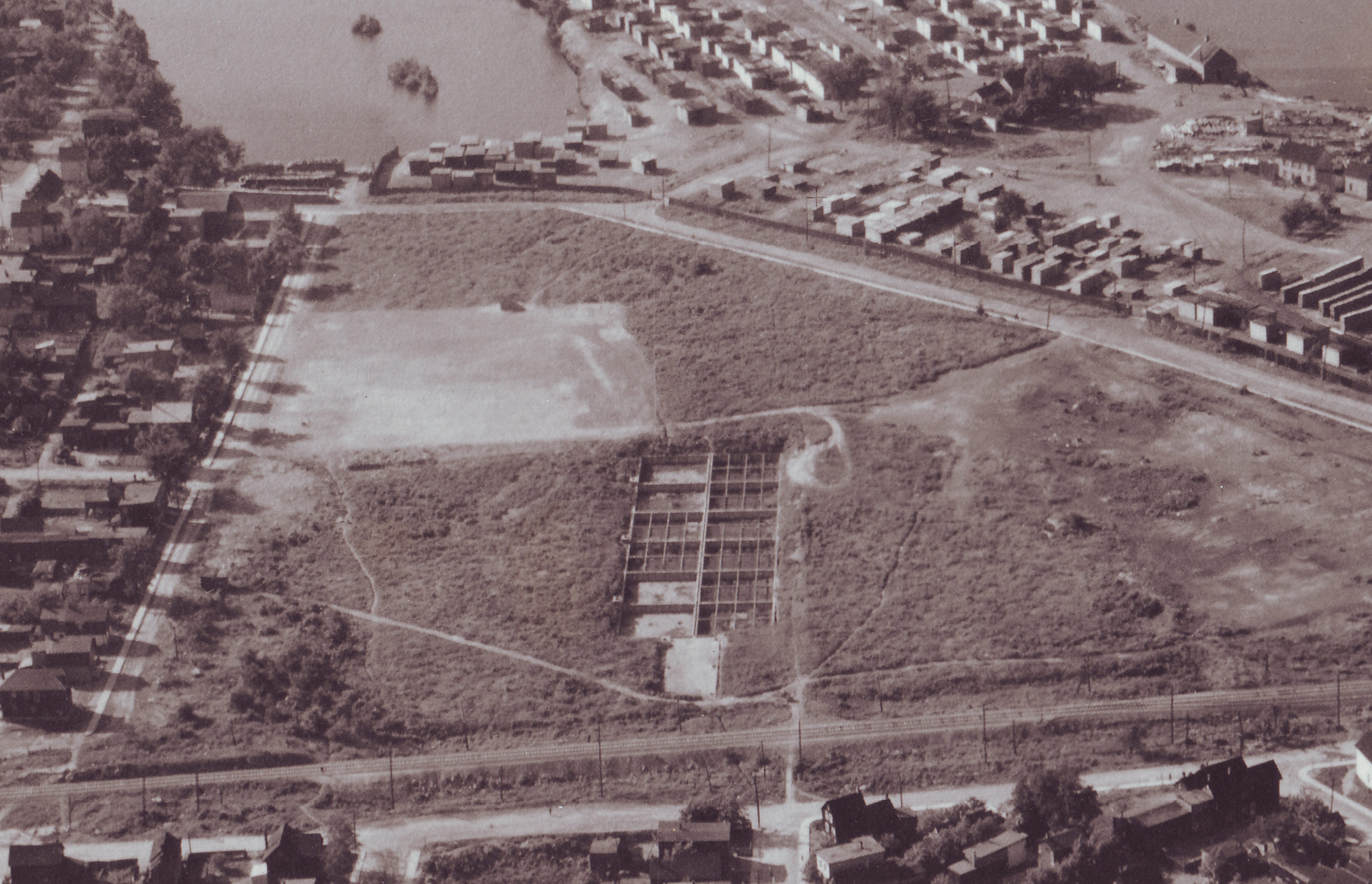 View of Laroche Park, June 24, 1927. Stonehurst Avenue is along the left, with Scott Street & CPR tracks running along the bottom. The septic system in the center (roughly 300x100 feet in size) and the new playground and baseball diamond is in the cleared area near the top. The patchy land along the east side of Stonehurst likely is evidence of the dump, which had existed there up until just two years prior.