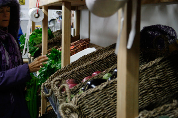  A customer peruses through Market Mobile’s produce.