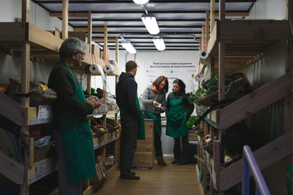 After opening up shop, Market Mobile workers await the first customers. From left to right: volunteers Rakesh Misra and Marc Duclos, project officer Shannon Szkurhan, and volunteer Tracy Facchin. Market Mobile will continue to visit Laroche Park until the end of December. The next visit will be Nov. 4.