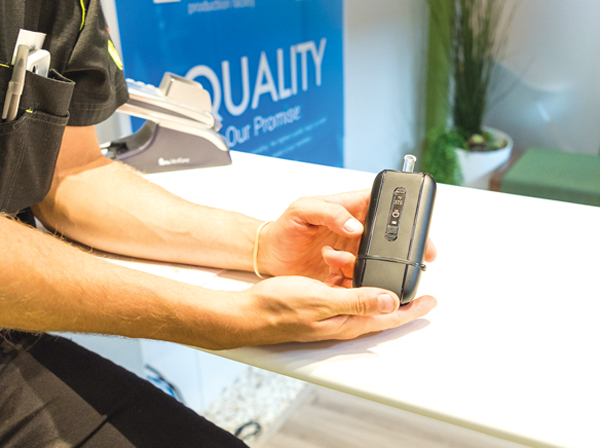 NAC staff demonstrate a vaporizer, their suggested method of cannabis use. The device releases the active chemicals in the plant without combustion, creating a healthier alternative to smoking. Photo by Ted Simpson