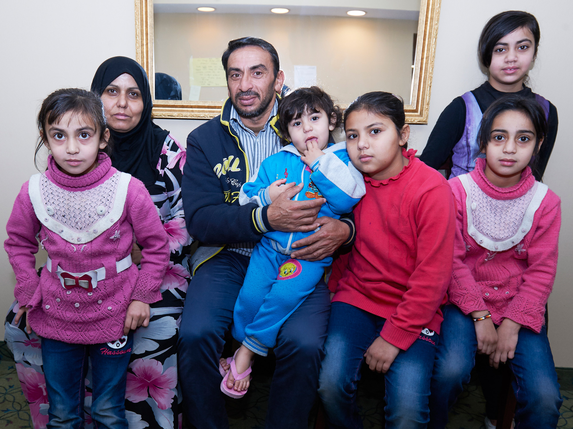 The Mohammad family arrived from Syria via Lebanon. The seven children (not all are pictured here) were between 2 to 10 years old when this photo was taken.?Photo by Ellen Bond