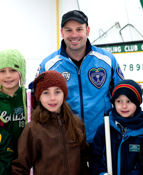 Visiting pro curler Jean Michel Menard inspires young Little Rock team at the Granite Club. Photo by Kate Settle.