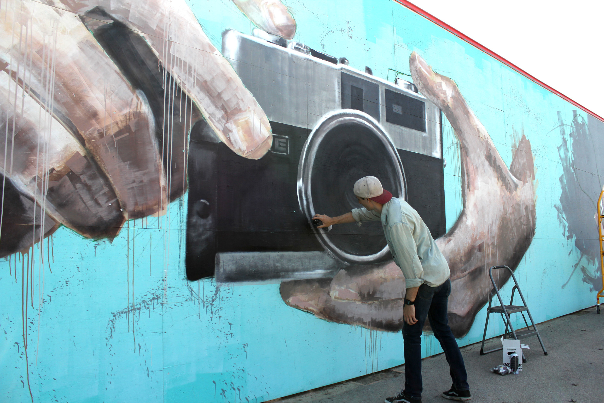 Ryan Smeeton working on his mural at the Canada Science and Technology Museum. Photo submitted by Ryan Smeeton