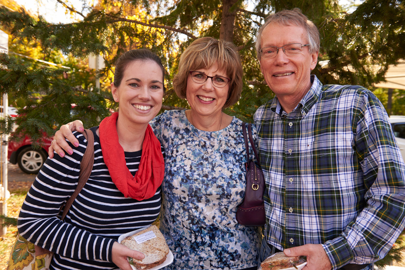 Sarah Moffat, with friends Laurie and John: “I come every week that I can because I live in the area. It’s beautiful, it’s part of the community, and there’s nice food.” Photos by Ellen Bond