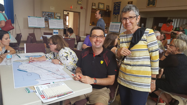 André Baril (seated) joined his neighbours at a recent public consultation about the future of Richmond Road and the Byron Corridor. Photo by Alyson Queen