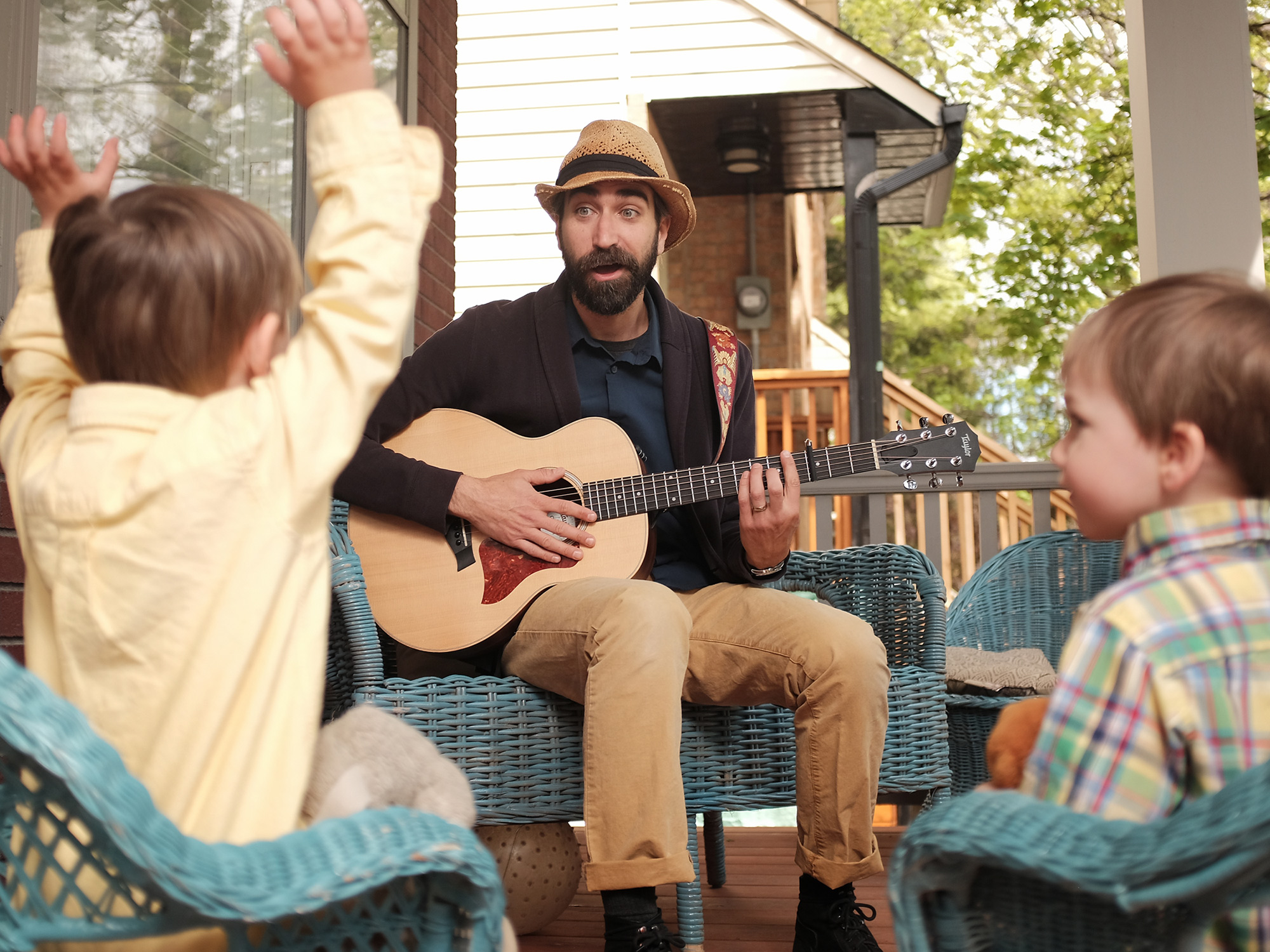 Derek McKinley’s Sing Song Party Time is one of the family friendly acts that will be taking the stage at Westfest this year. He’s pictured here on his Tweedsmuir Avenue porch with his children Oscar, 3, on the left, and Francis, 2, on the right. Photo by Ted Simpson