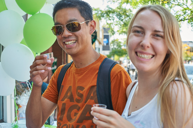 Hintonburg residents Kim Truong-Trieu and Kayla Wemt are enjoying their first time at the Tastes of Wellington West. Here they are tasting samples of natural electrolytes from Watson’s Pharmacy & Compounding Center.